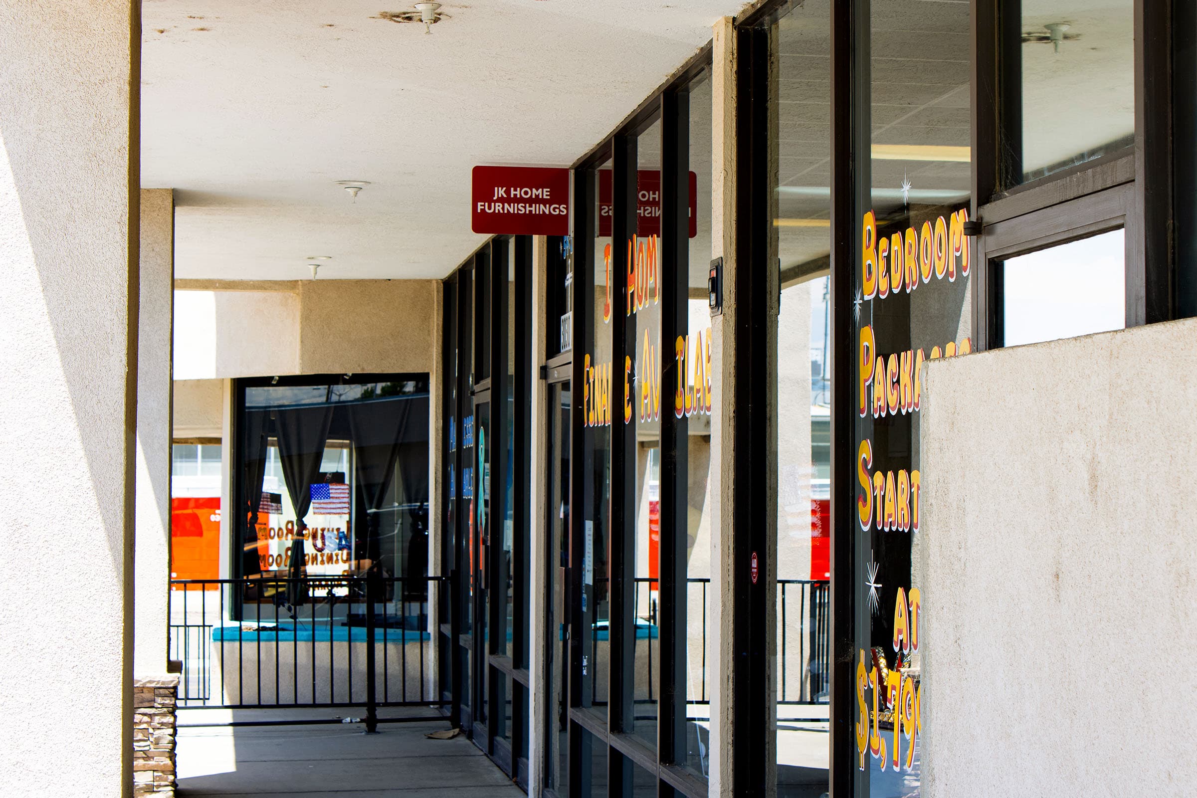 Covered walkway outside JK Home Furnishings at San Juan Plaza